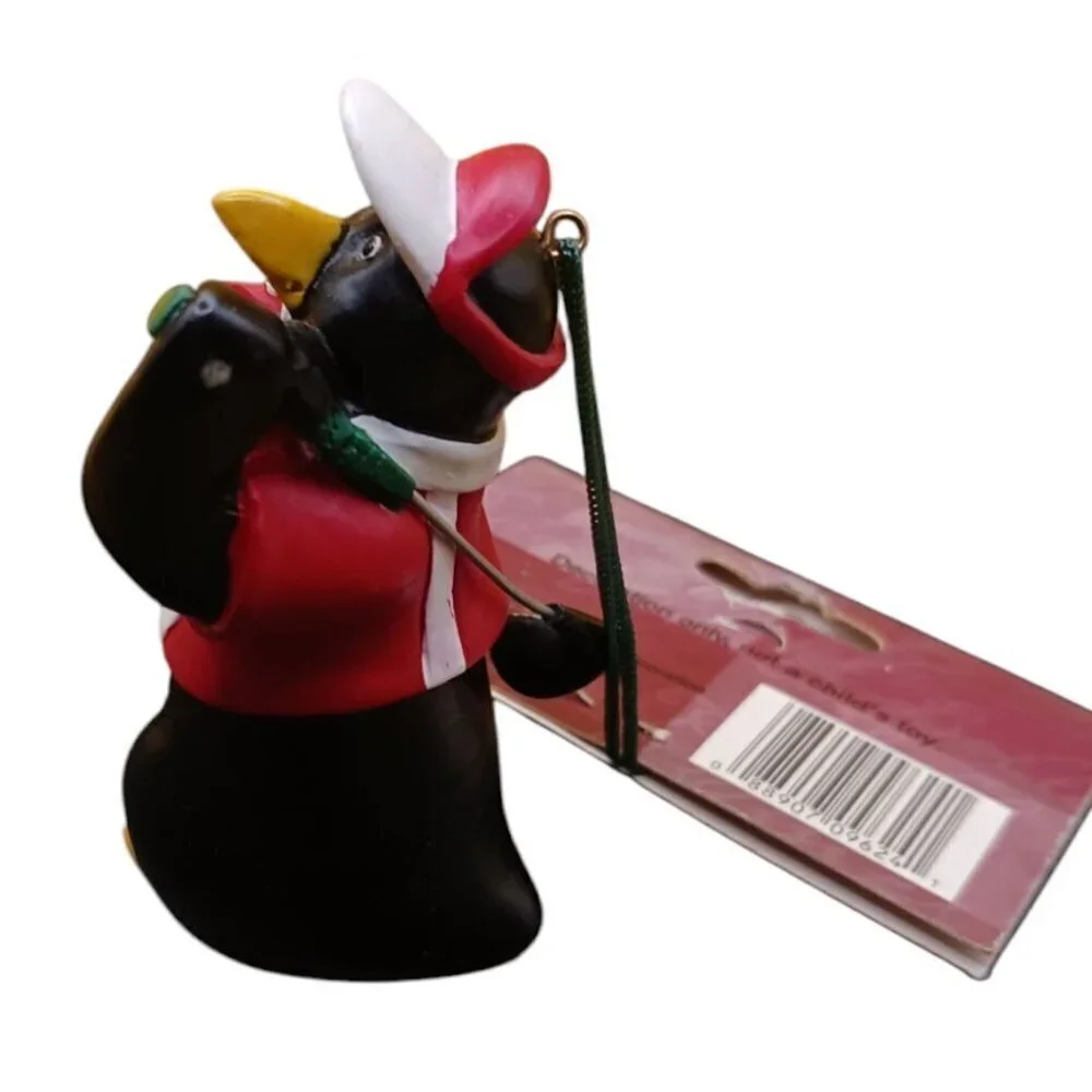 Trim a traditional golfing penguin christmas ornament